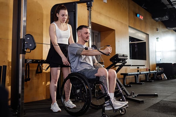 Person with a spinal cord injury exercising to reconnect with their body